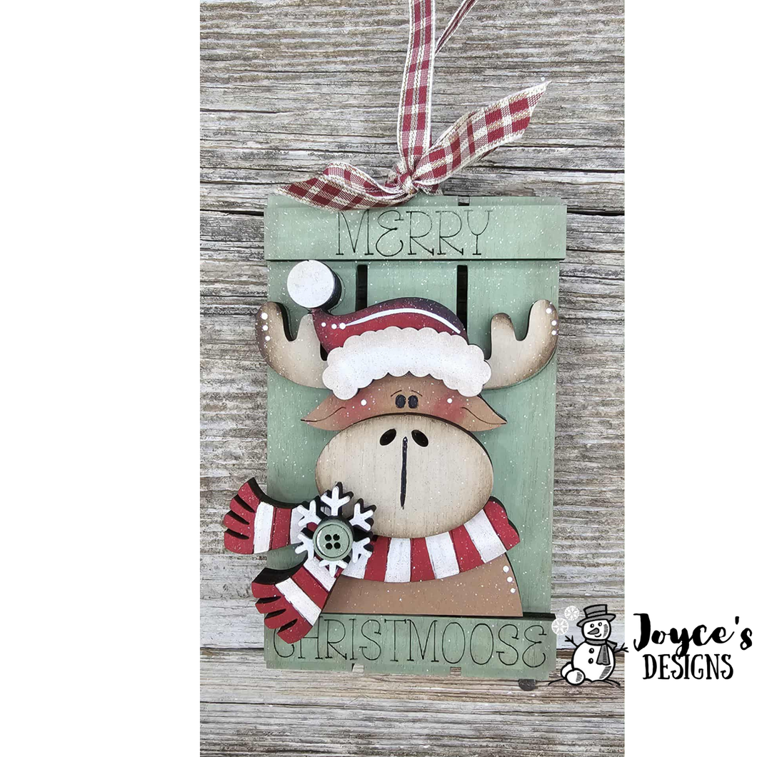 Santa hat on moose on sleigh ornament