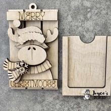 Load image into Gallery viewer, Santa hat on moose on sleigh ornament
