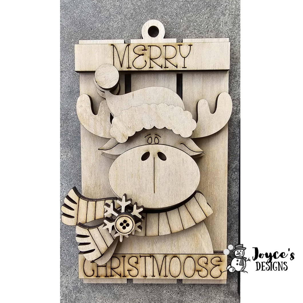 Santa hat on moose on sleigh ornament